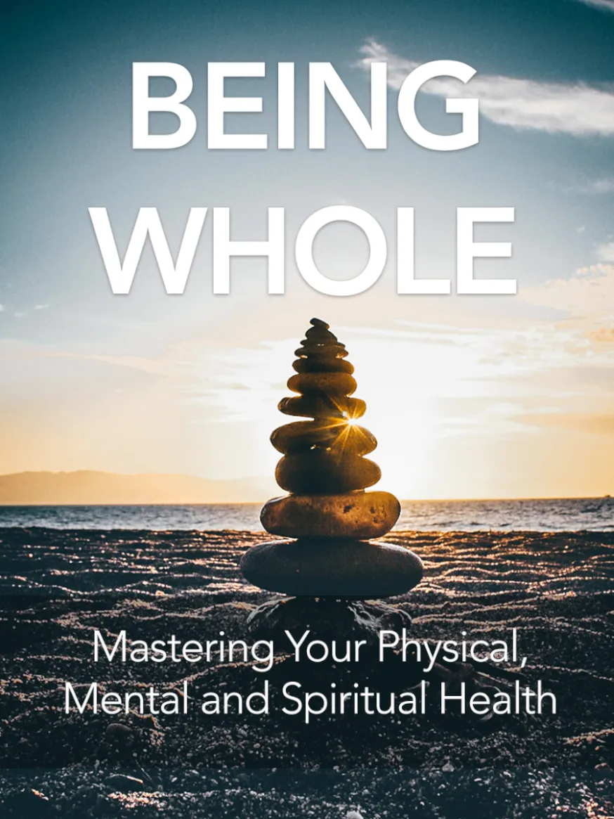 Balanced stones on a beach at sunset with the words "Being Whole" above and "Mastering Your Physical, Mental and Spiritual Health" below.